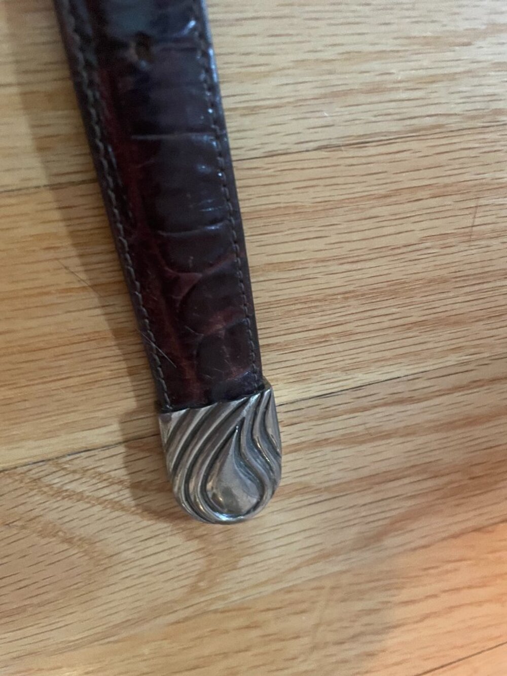 Vicenza sport Genuine Calfskin alligator print belt with bronze buckle.